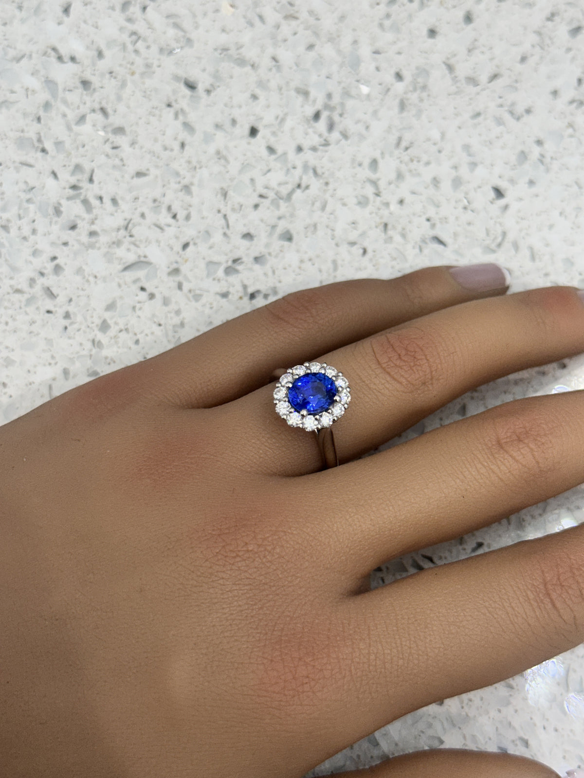 Platinum Blue Oval Sapphire & Diamond Halo Ring