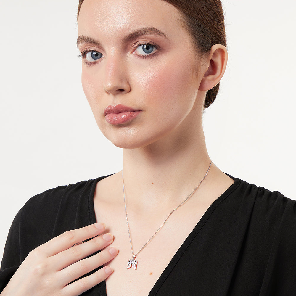 Sterling Silver Wing Pendant Set With A Cubic Zirconia Heart Centre