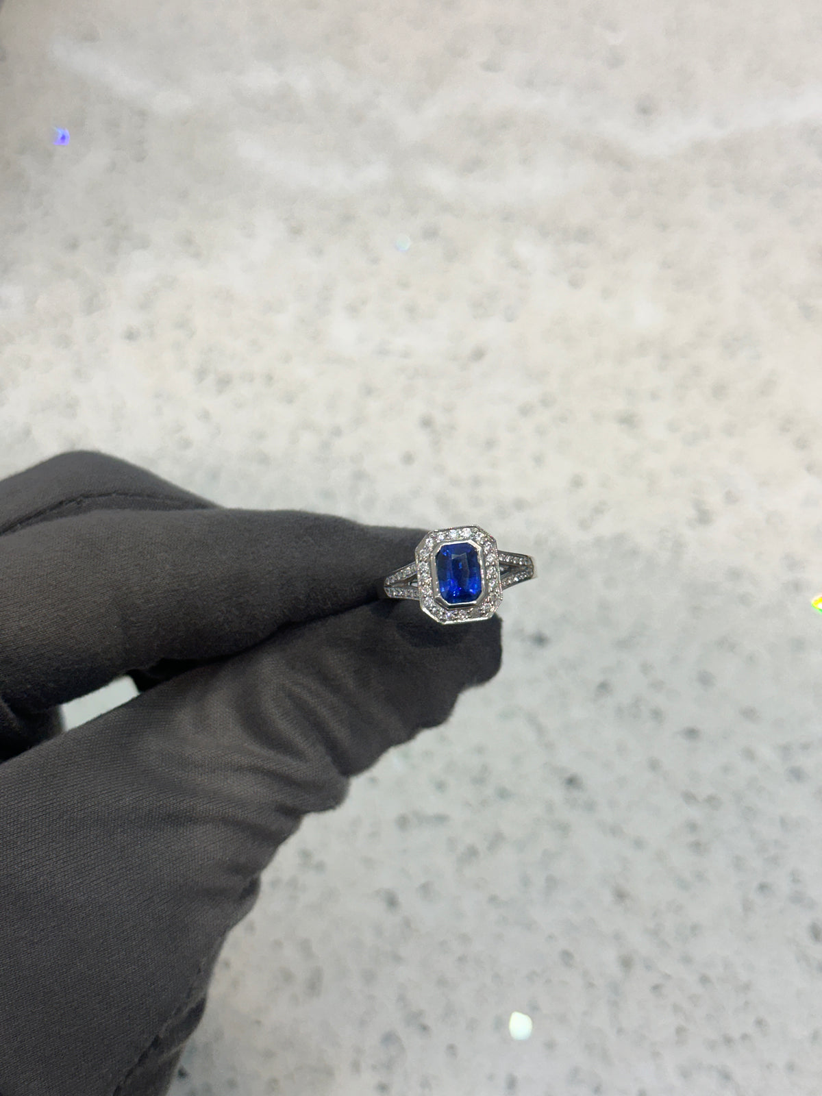 Platinum Blue Emerald cut Sapphire & Diamond Halo Split Shank Ring