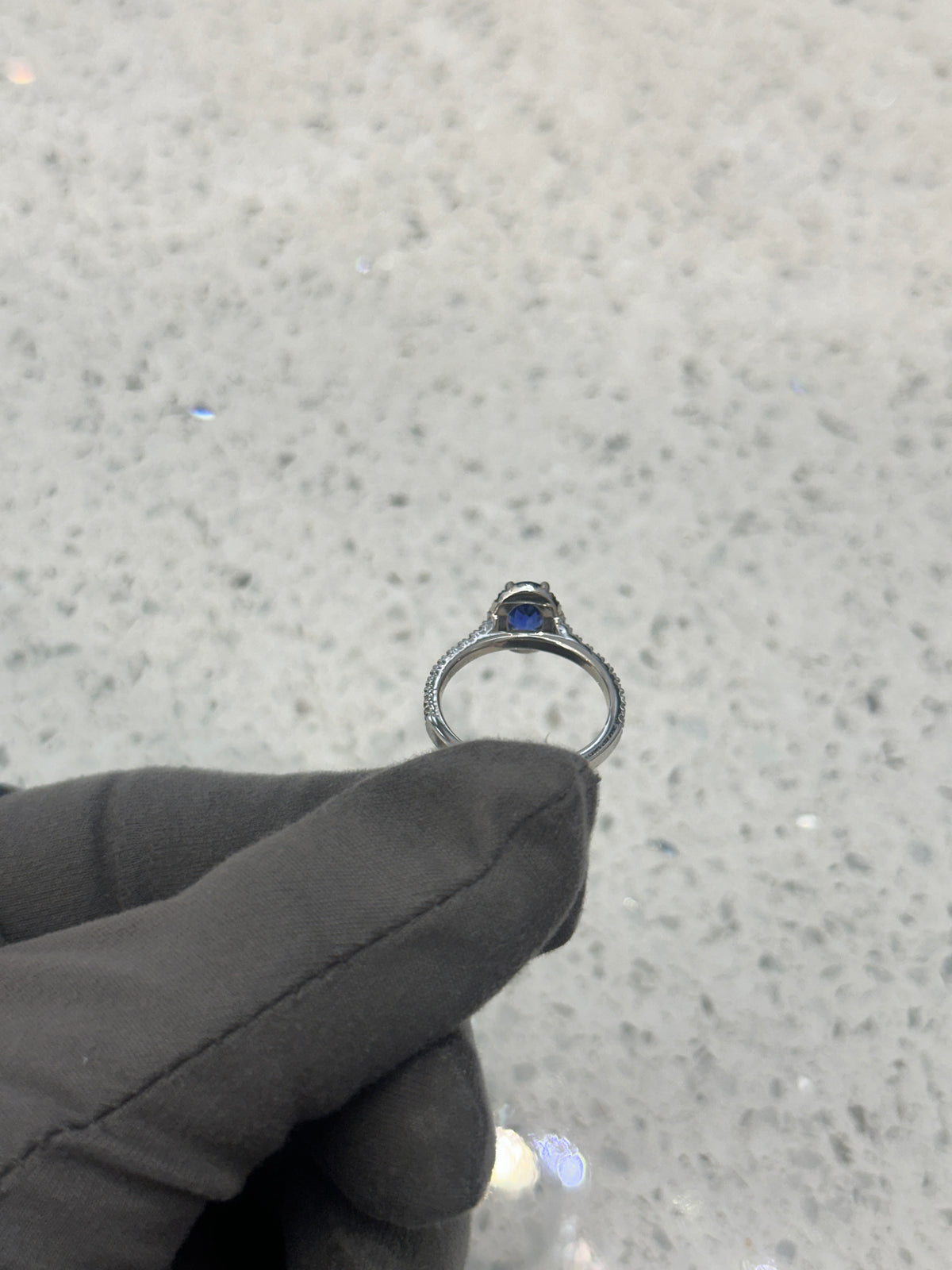 Platinum Blue Sapphire & Diamond Halo Oval Ring with diamond set shoulders