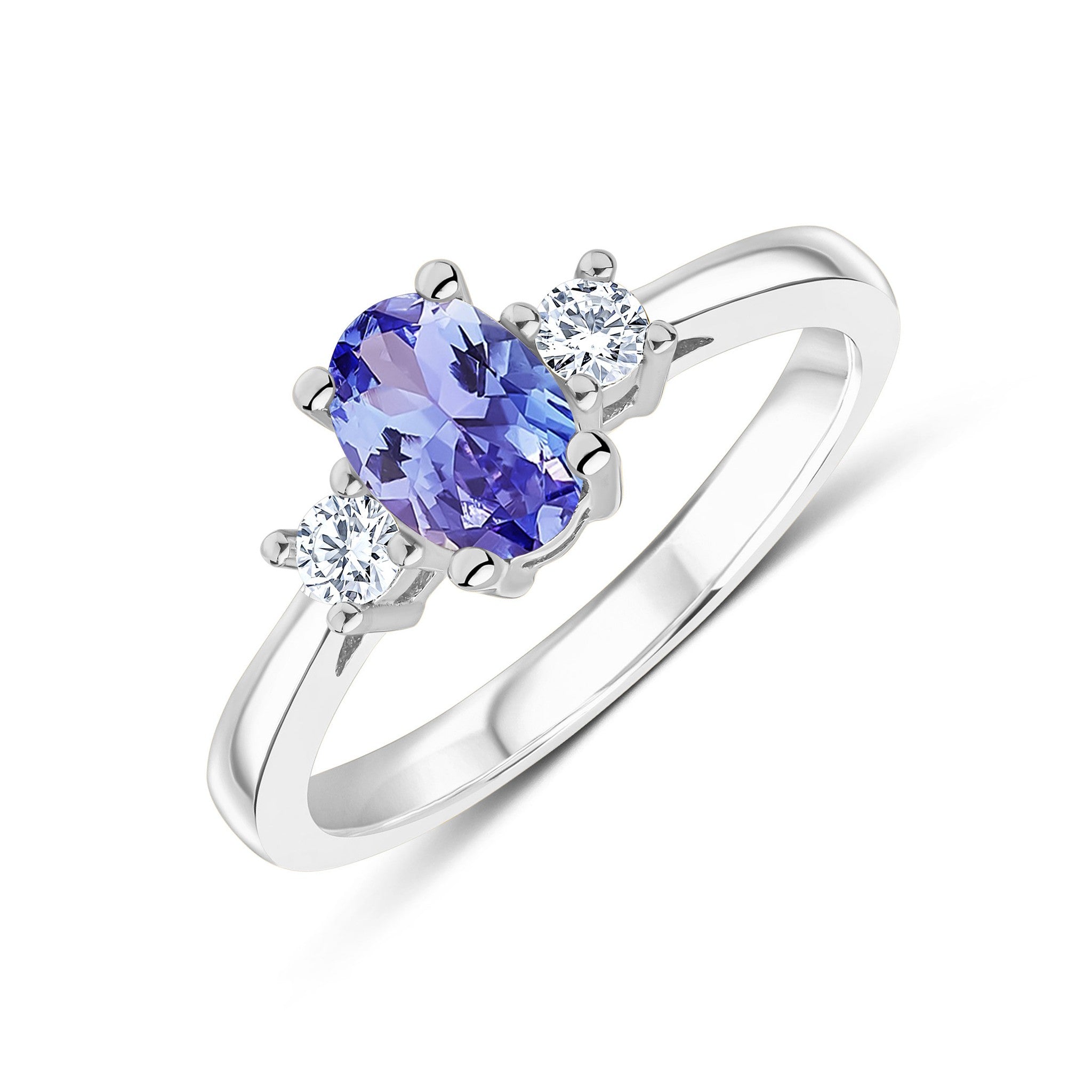 9CT WG 7X5 OVAL TANZANITE AND ROUND DIAMOND CLAW SET 3ST RING