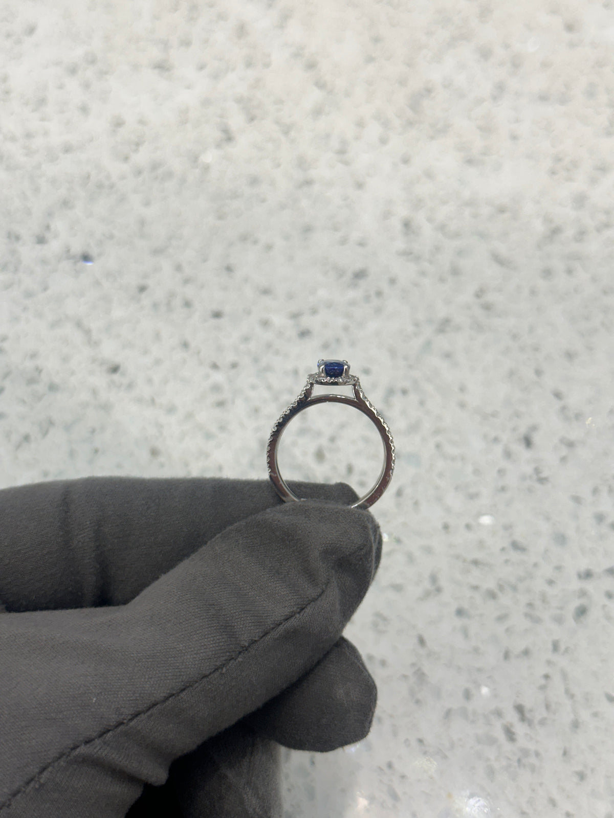 Platinum Blue Sapphire & Diamond Halo Oval Ring with diamond set shoulders