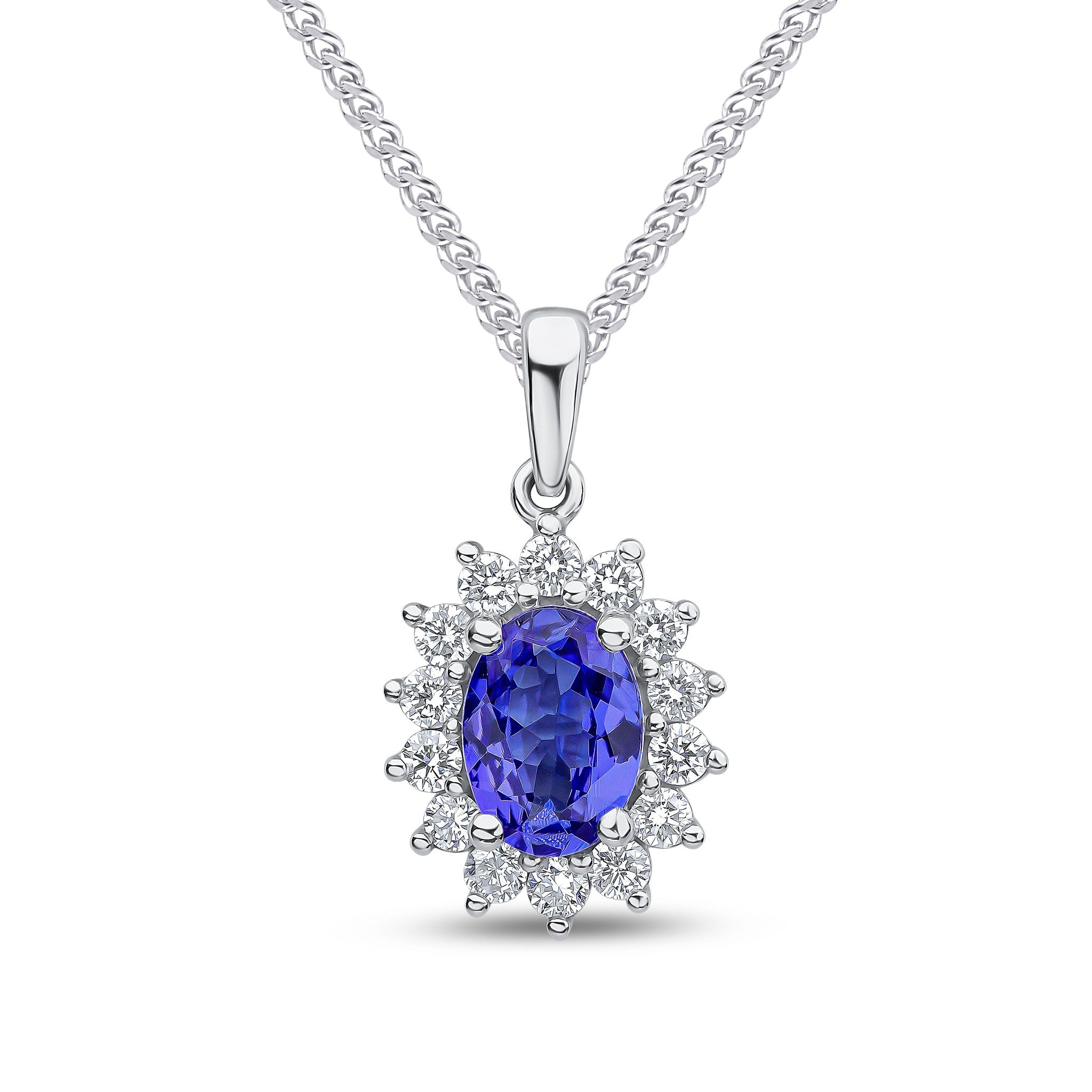 18CT WG 7X5 OVAL TANZANITE AND ROUND DIAMOND CLAW SET CLUSTER PENDANT